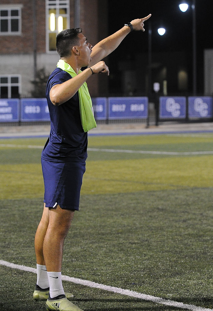 Soccer student assistant Nicolau Neto yells to the team in the remaining minutes of the game on Friday